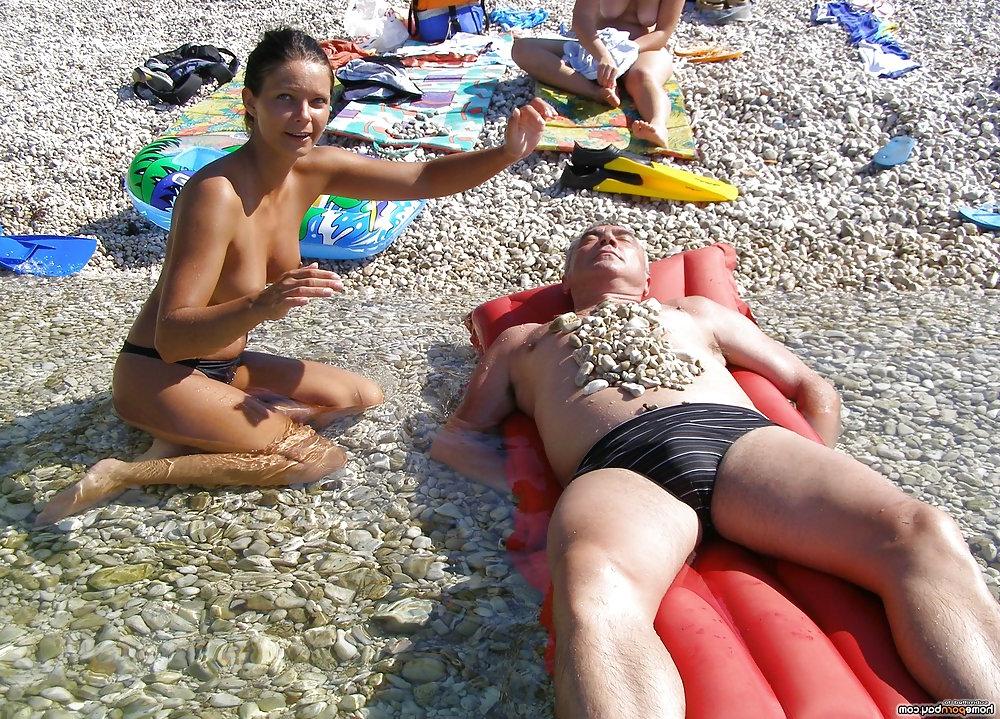 11P Topless beach girls teasing