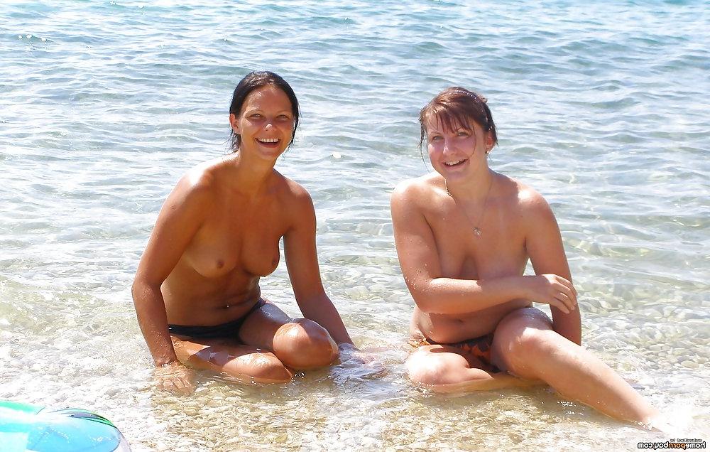 11P Topless beach girls teasing