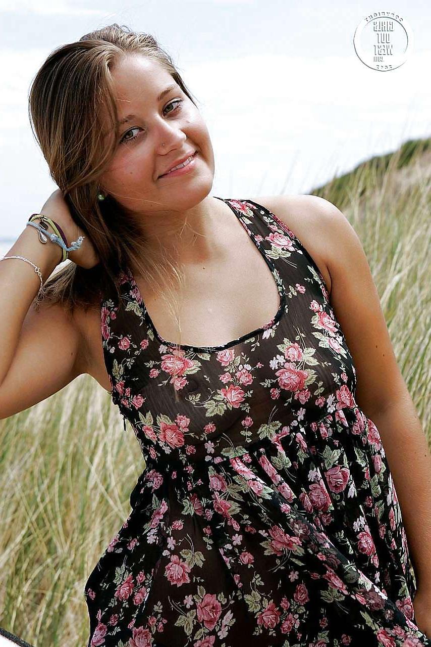 16P Busty plump amateur hottie at the beach