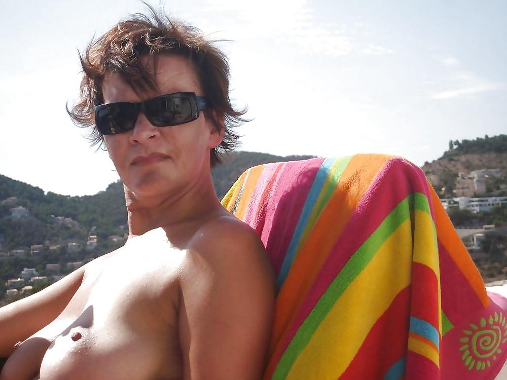 25P Short-Haired, Busty, Saggy Mature on the Beach