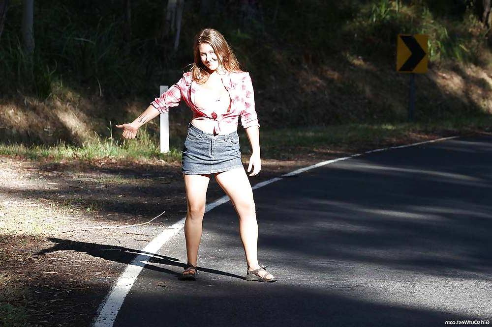 16P Busty cutie shows her hairy pussy by the road