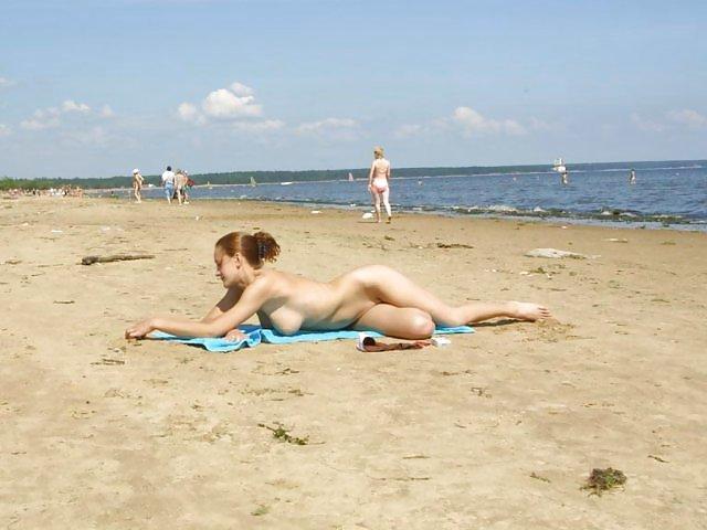 13P Busty beach girl.
