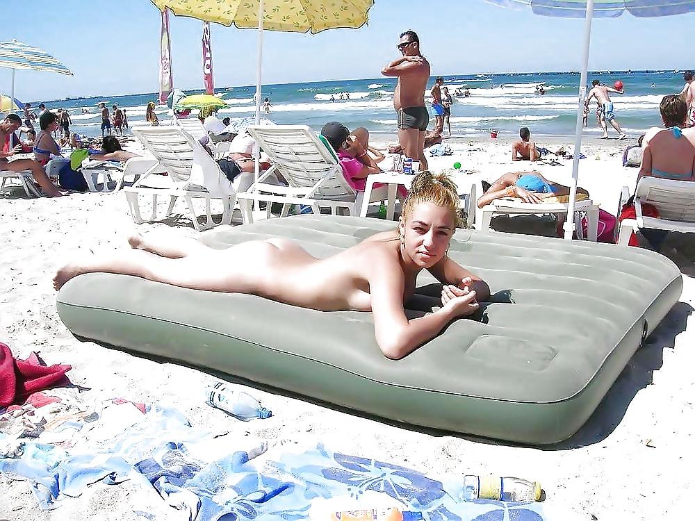25P Naked on the public beach...