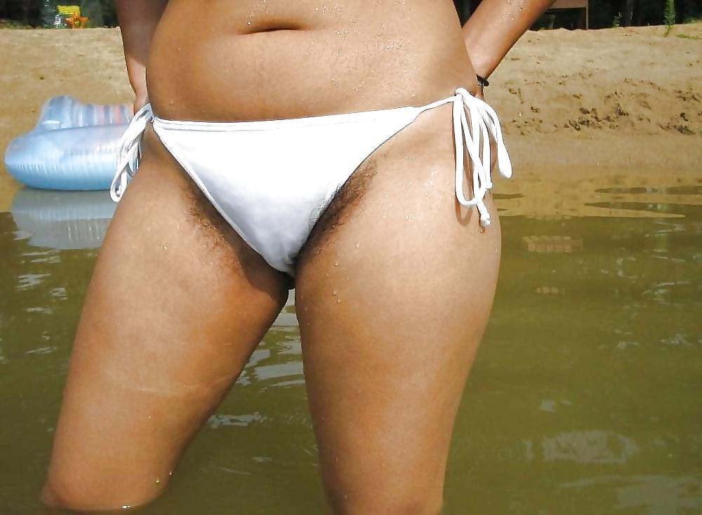 14P Hairy woman on the beach