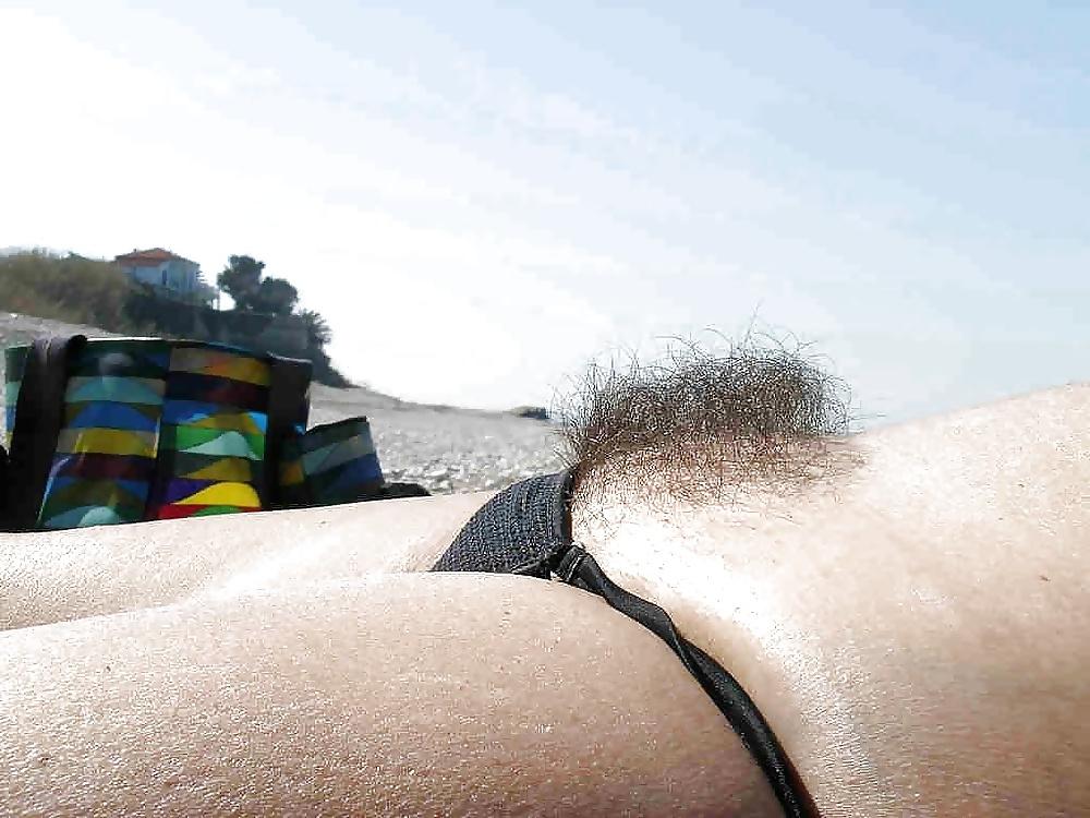14P Hairy woman on the beach