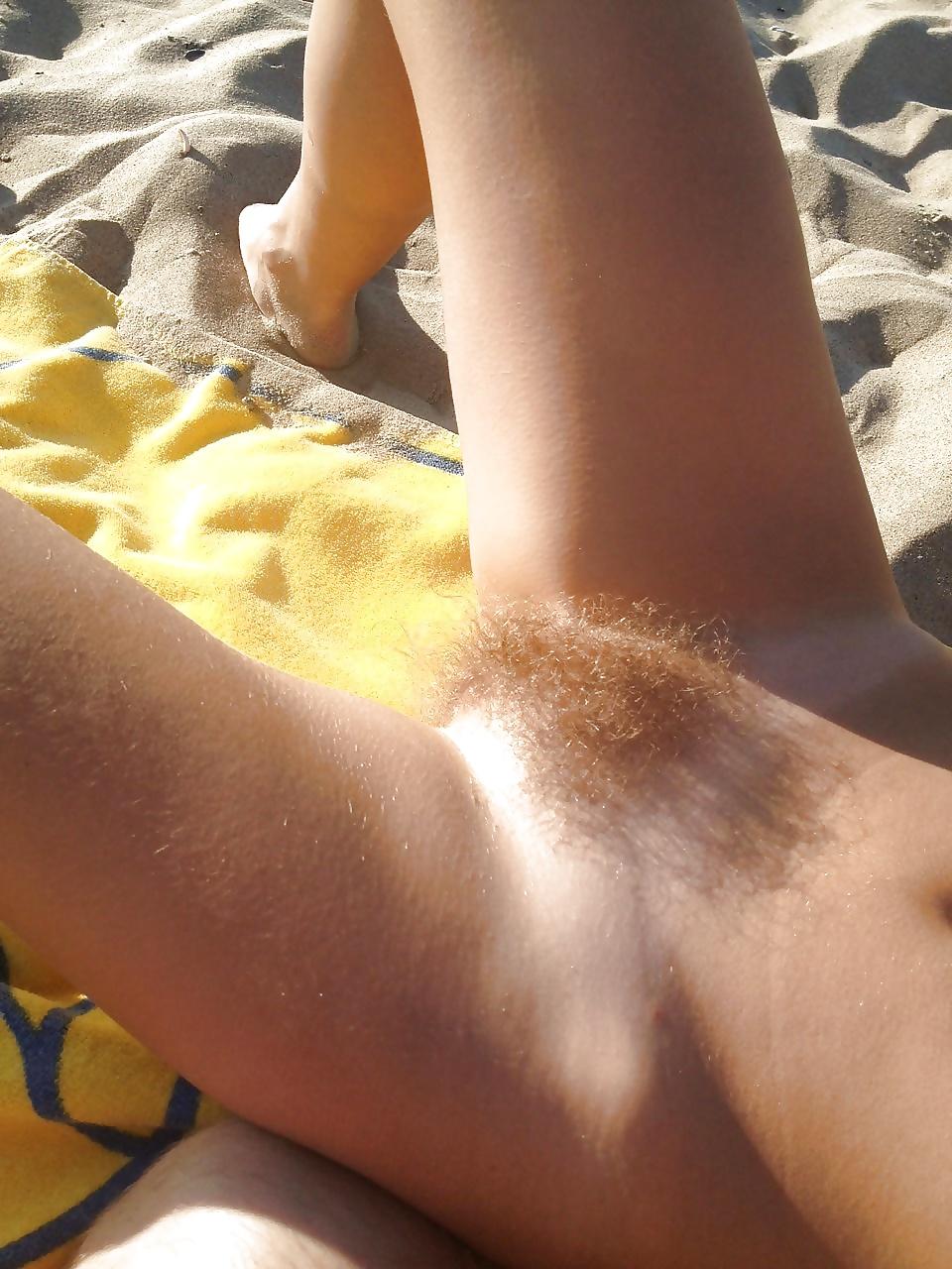 7P Hairy woman on the beach 1