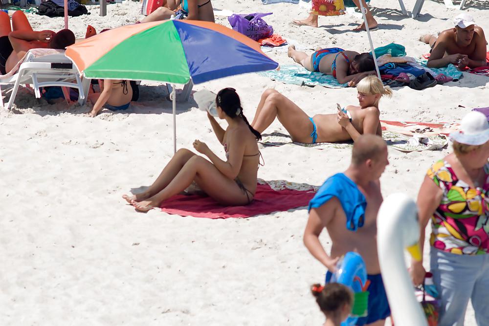 25P Thongs and toplessness on beach Ukraine))