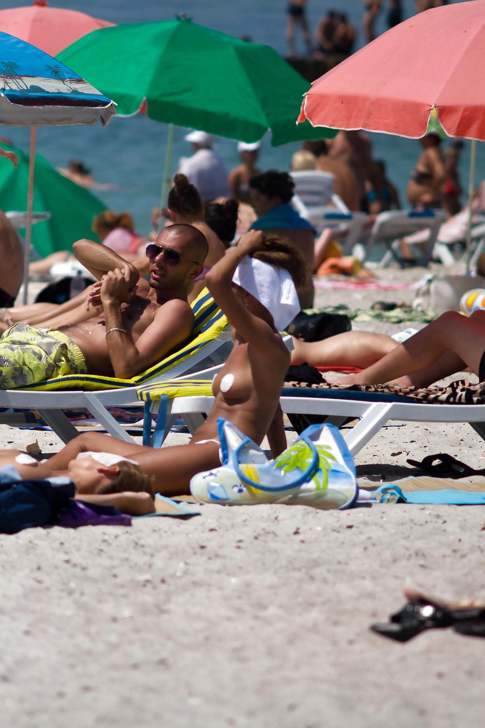 25P Thongs and toplessness on beach Ukraine))