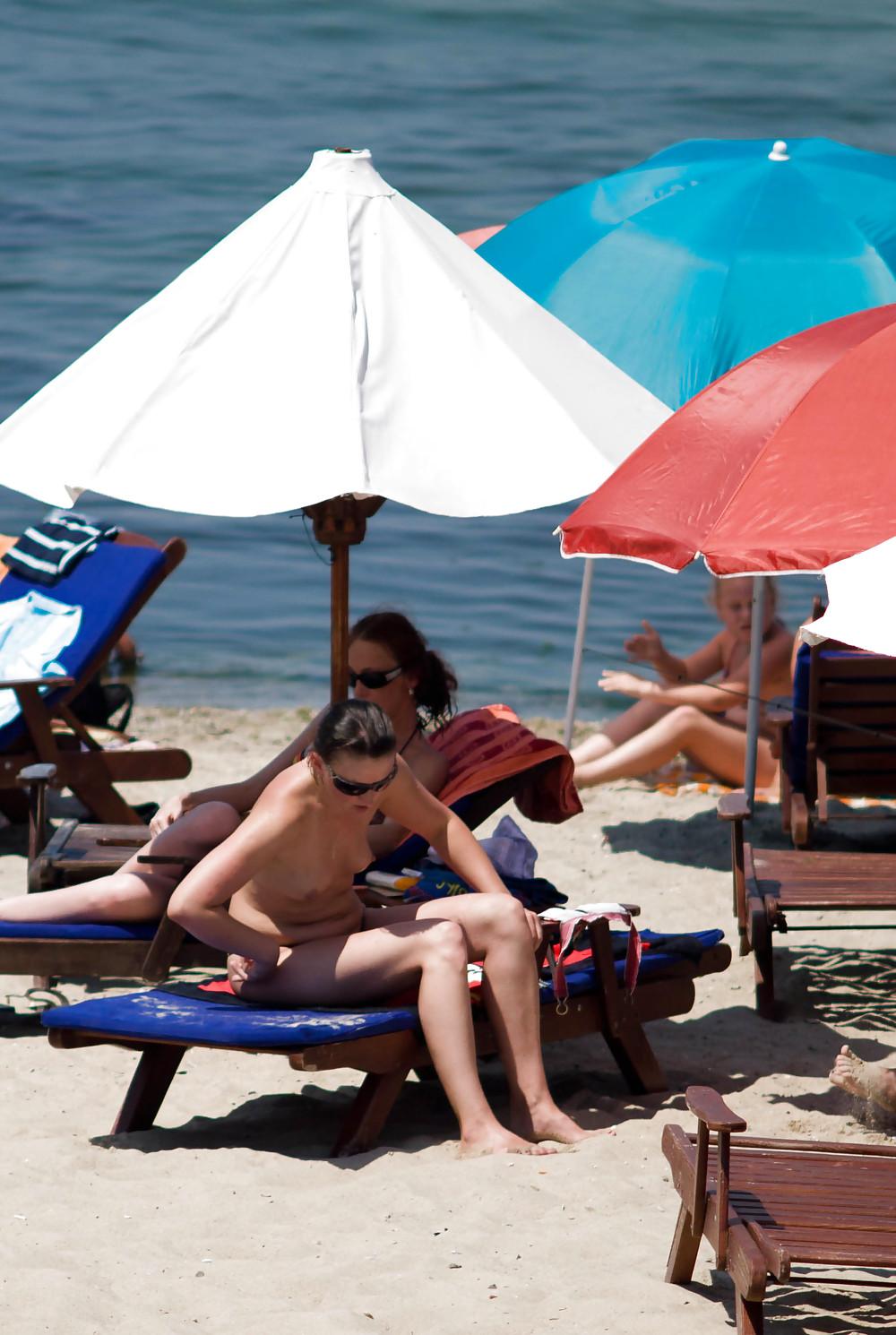 25P Thongs and toplessness on beach Ukraine))