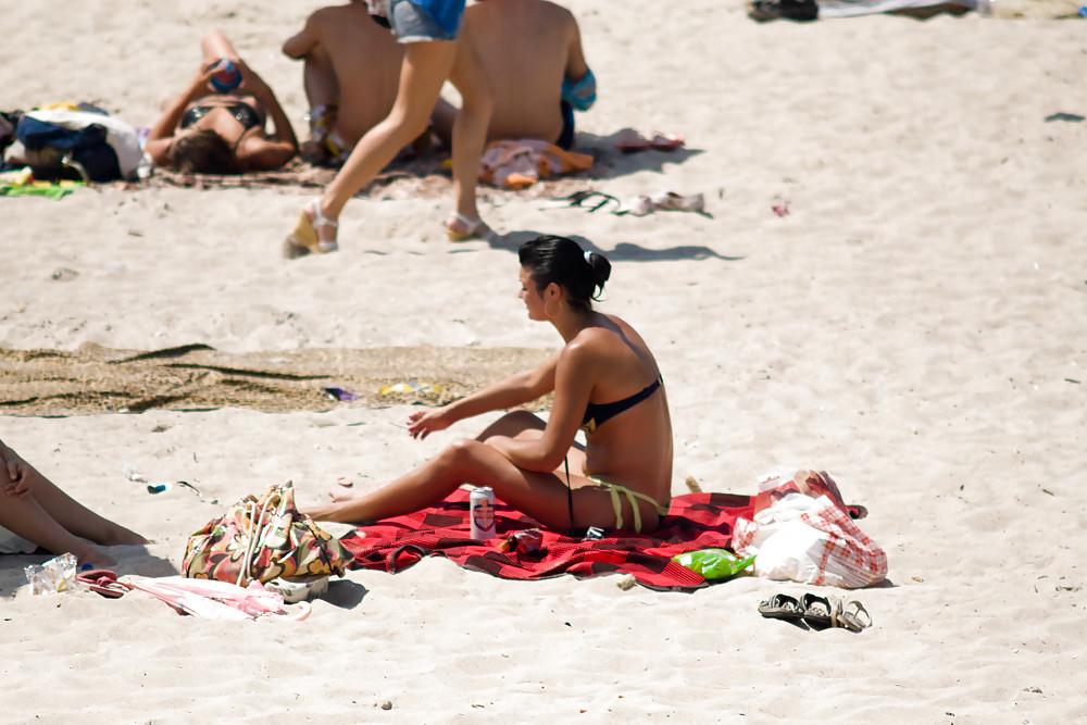 25P Thongs and toplessness on beach Ukraine))