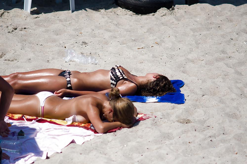25P Thongs and toplessness on beach Ukraine))