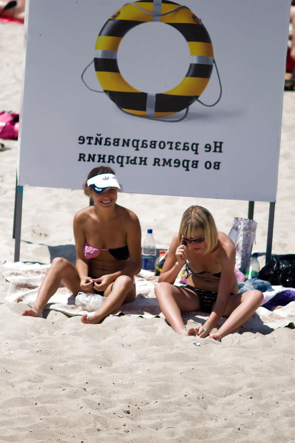 25P Thongs and toplessness on beach Ukraine))