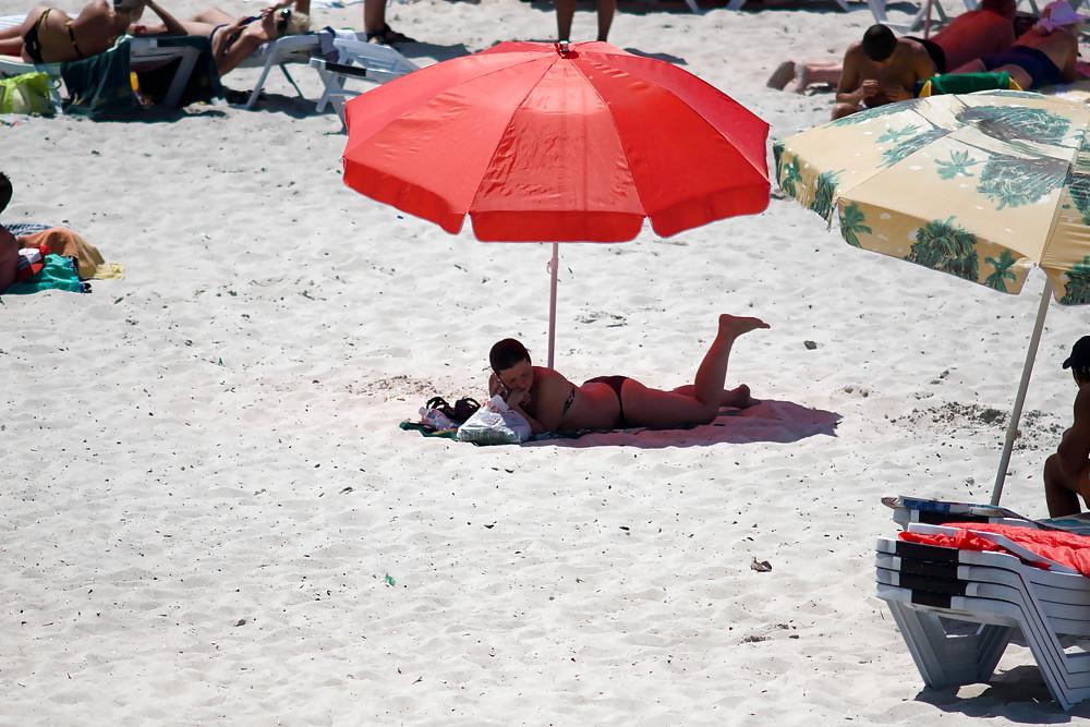 25P Thongs and toplessness on beach Ukraine))