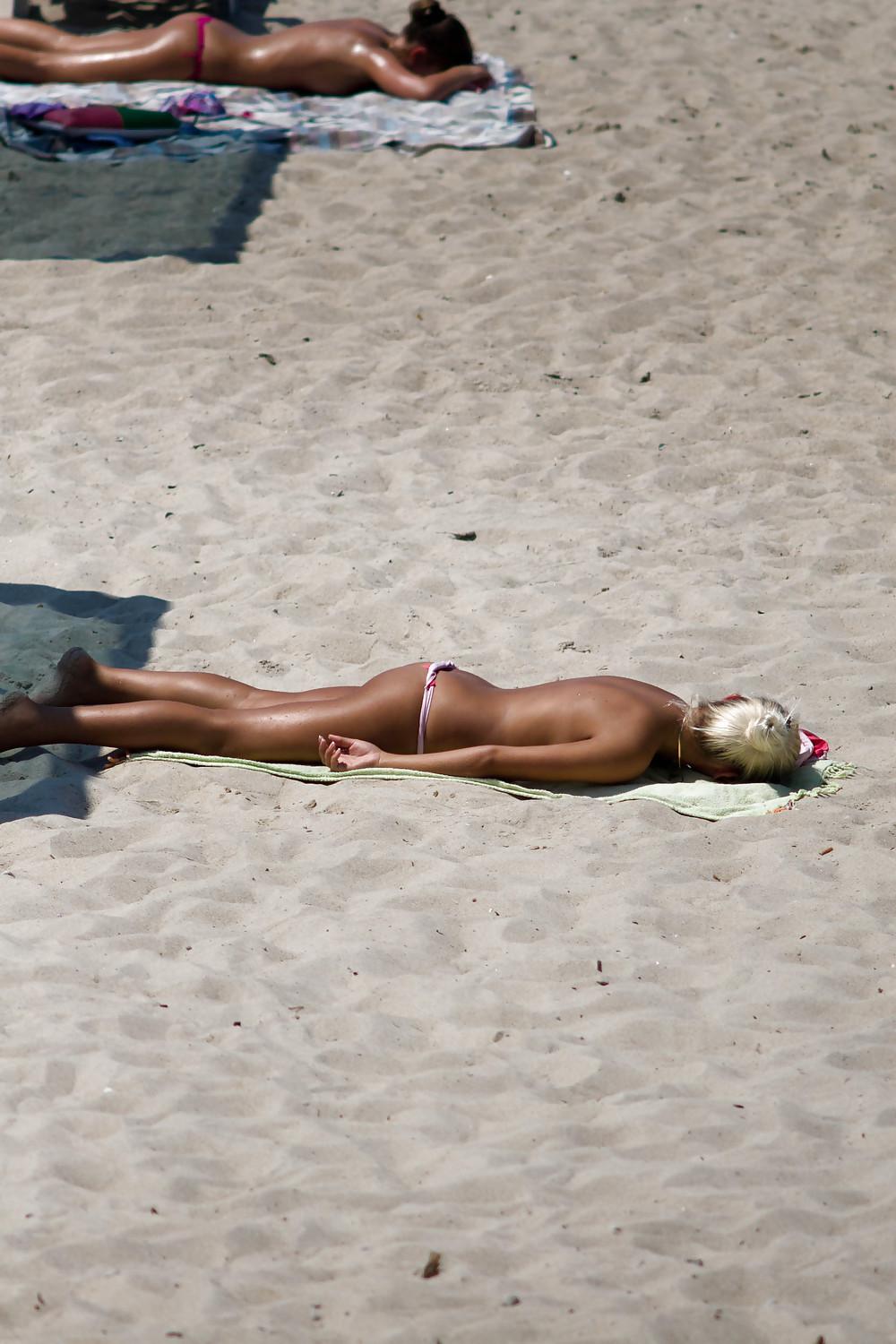 25P Thongs and toplessness on beach Ukraine))