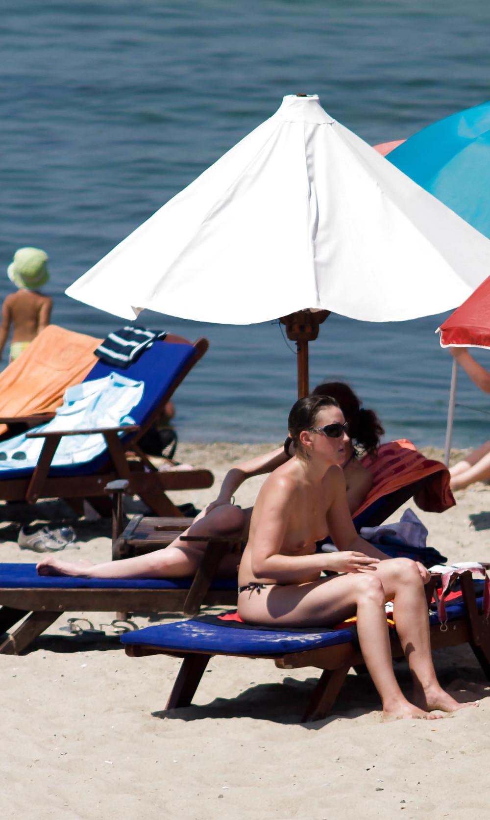 25P Thongs and toplessness on beach Ukraine))
