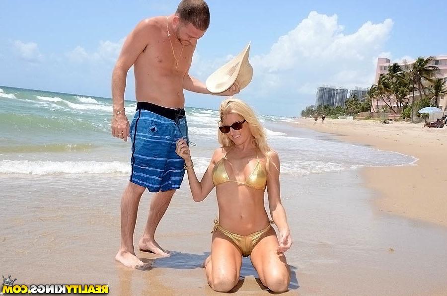 16P Horny cougar in sunglasses gets her shaved gash slammed on the beach
