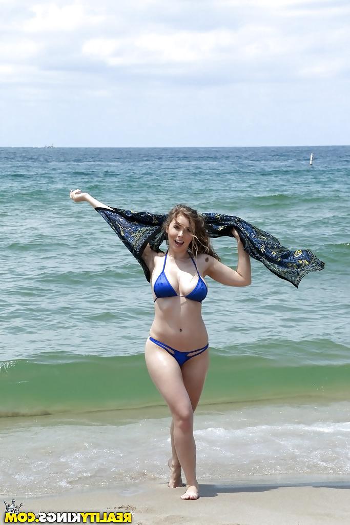 15P Beach babe Lena Paul freeing nice melons from bikini by swimming pool