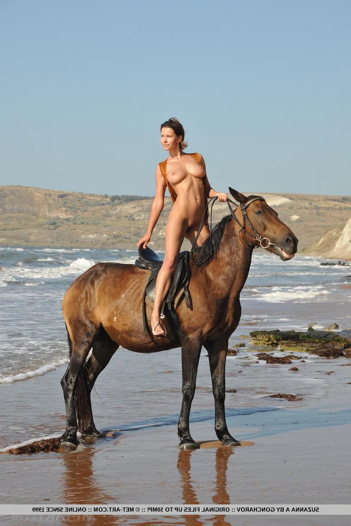 18P Big titted Suzanna A shows shaved twat posing naked on beach with horse