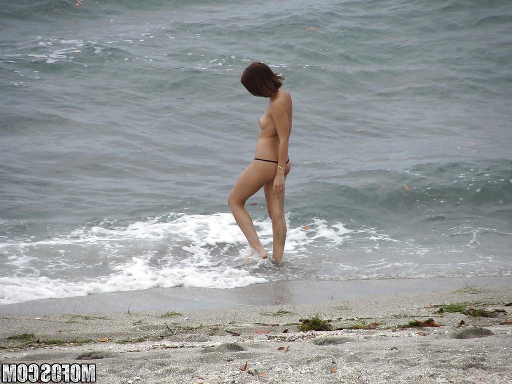 16P Brunette teen Krystal Banks gets sneak-peaked by a voyeur on the beach