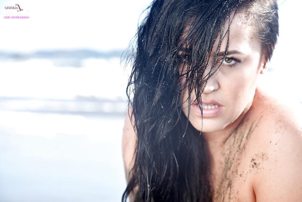 16P Chesty brunette pornstar Leanne Crow exposing huge hooters on the beach