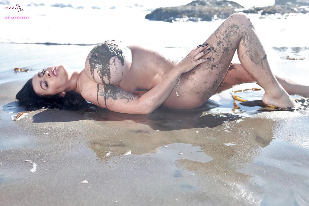 16P Chesty brunette pornstar Leanne Crow exposing huge hooters on the beach