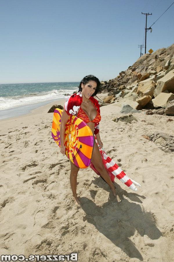 16P Busty MILF Veronica Rayne strips off bikini and posing on the beach