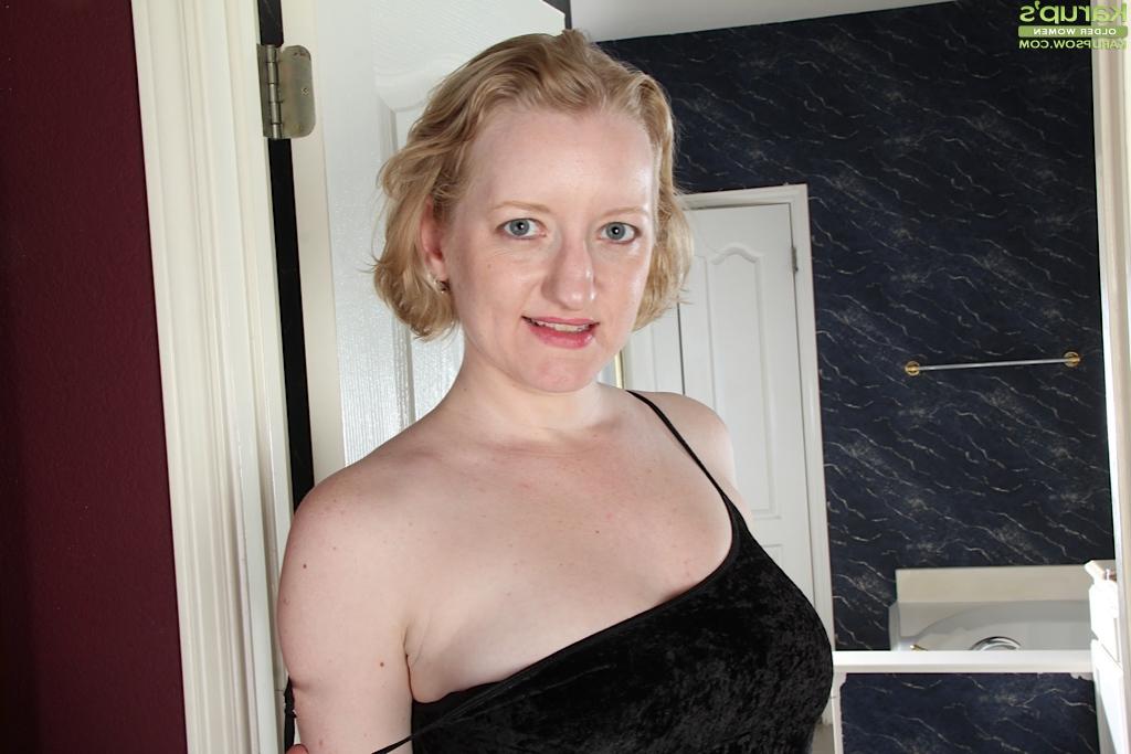 16P Older blonde with short hair Anya Volcov flaunting large natural breasts