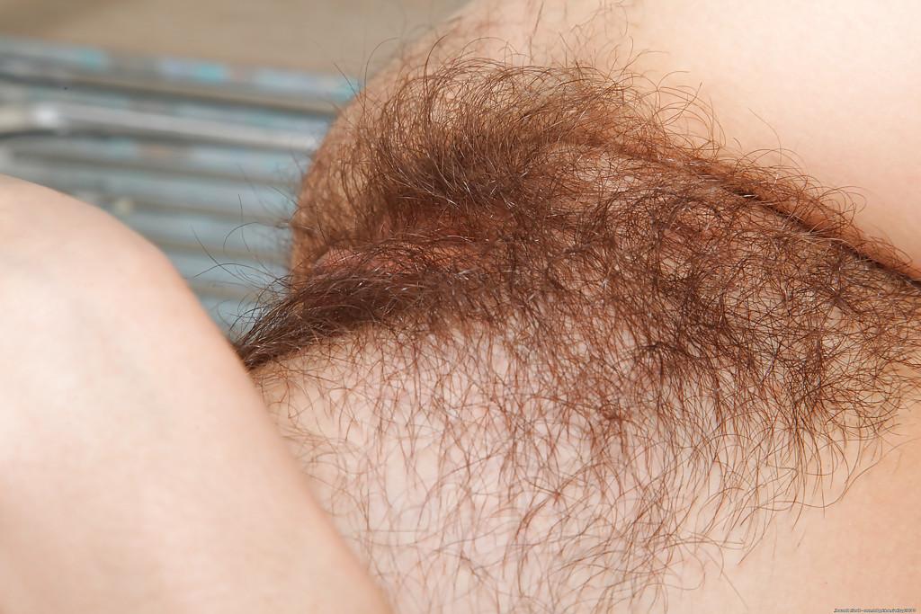 16P Sassy mature gal in sexy nylons undressing and spreading her shaggy twat