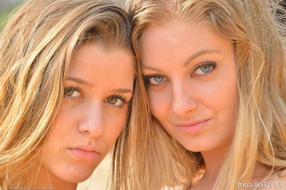 16P Young lesbians with nice tits spreading naked ass and toying pussy at beach