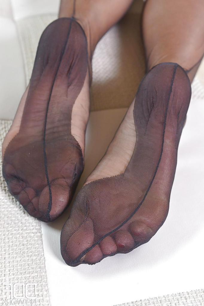 16P Top rated babe Eva Parcker showing off sexy legs in black nylons
