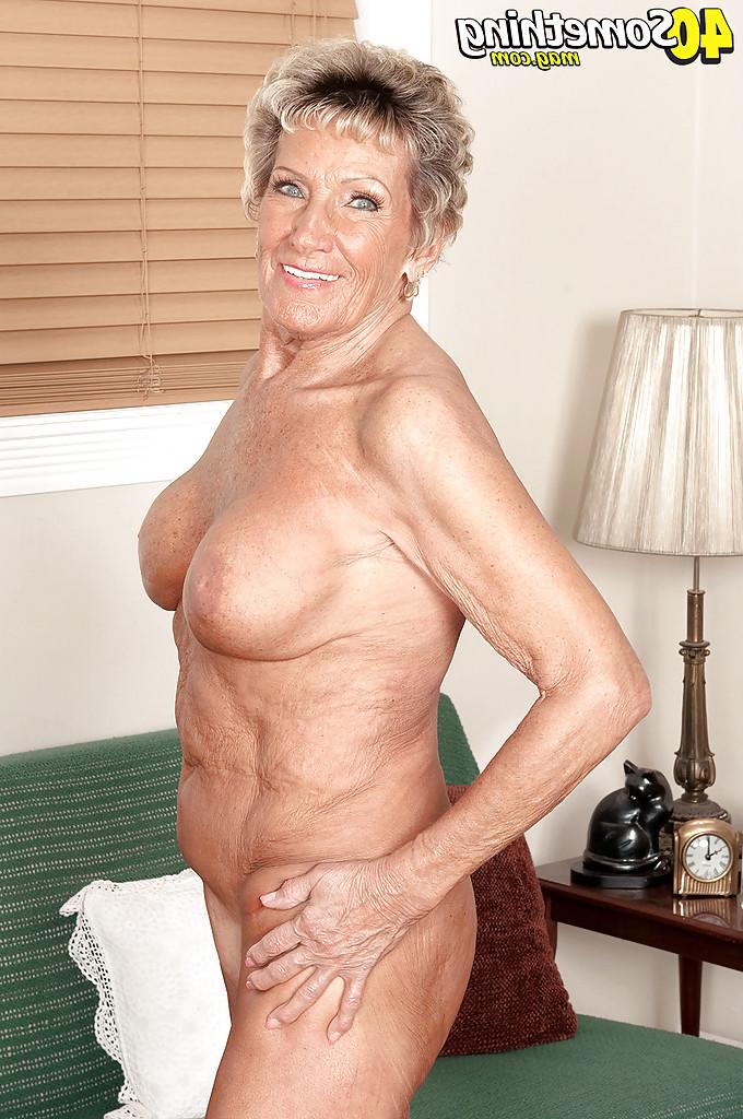 16P Busty granny Sandra Ann lustfully plays with her ass in tight lingerie