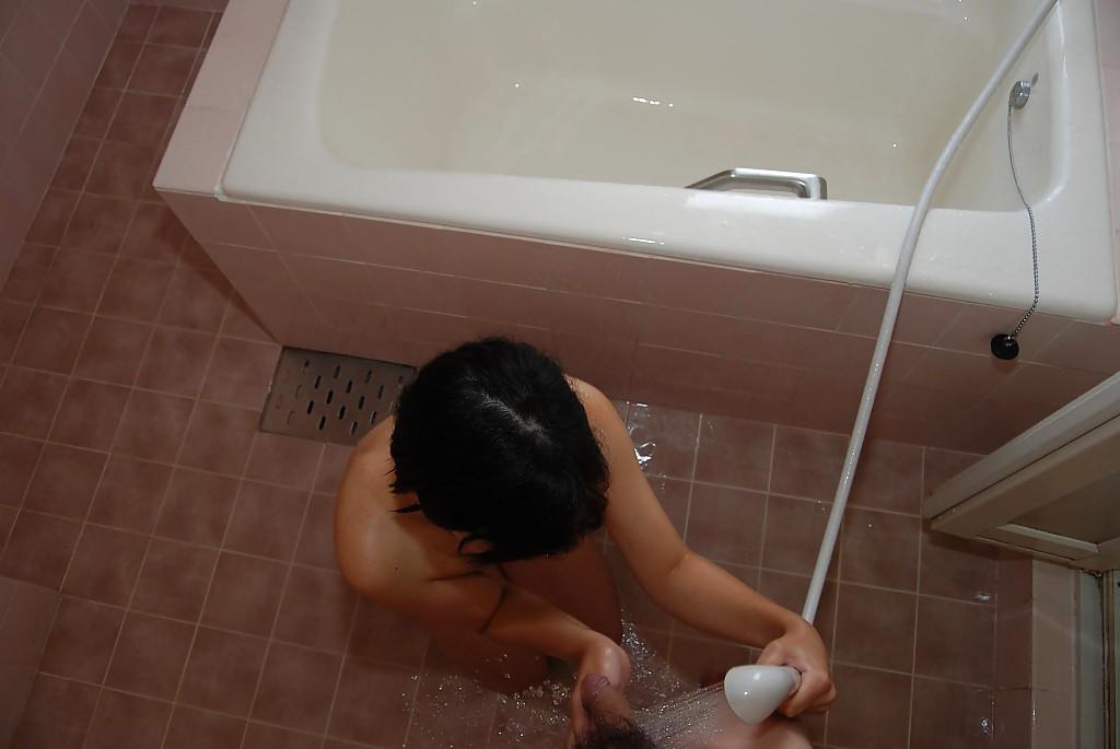 16P Filthy asian MILF gives a blowjob and gets her shaved twat banged tough
