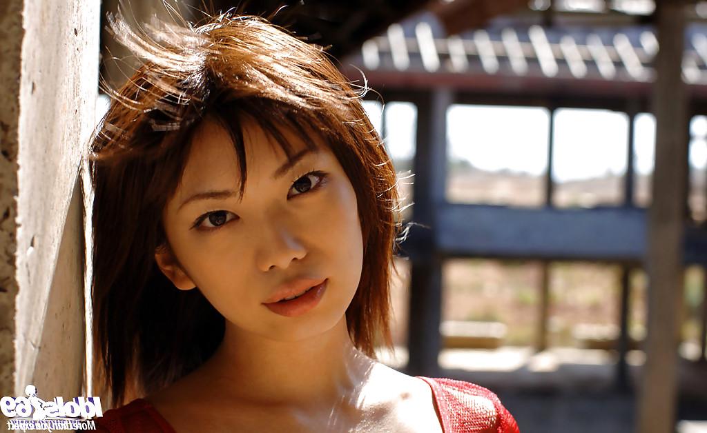 15P Stunning asian coed Hikari Hino poses wearing only a sheer red dress