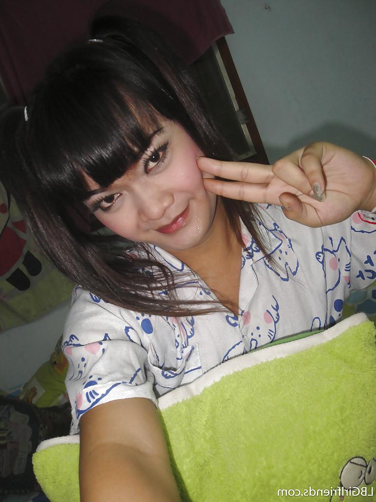 16P Tiny Asian shemale Ping is into kinky anal insertions and pigtails