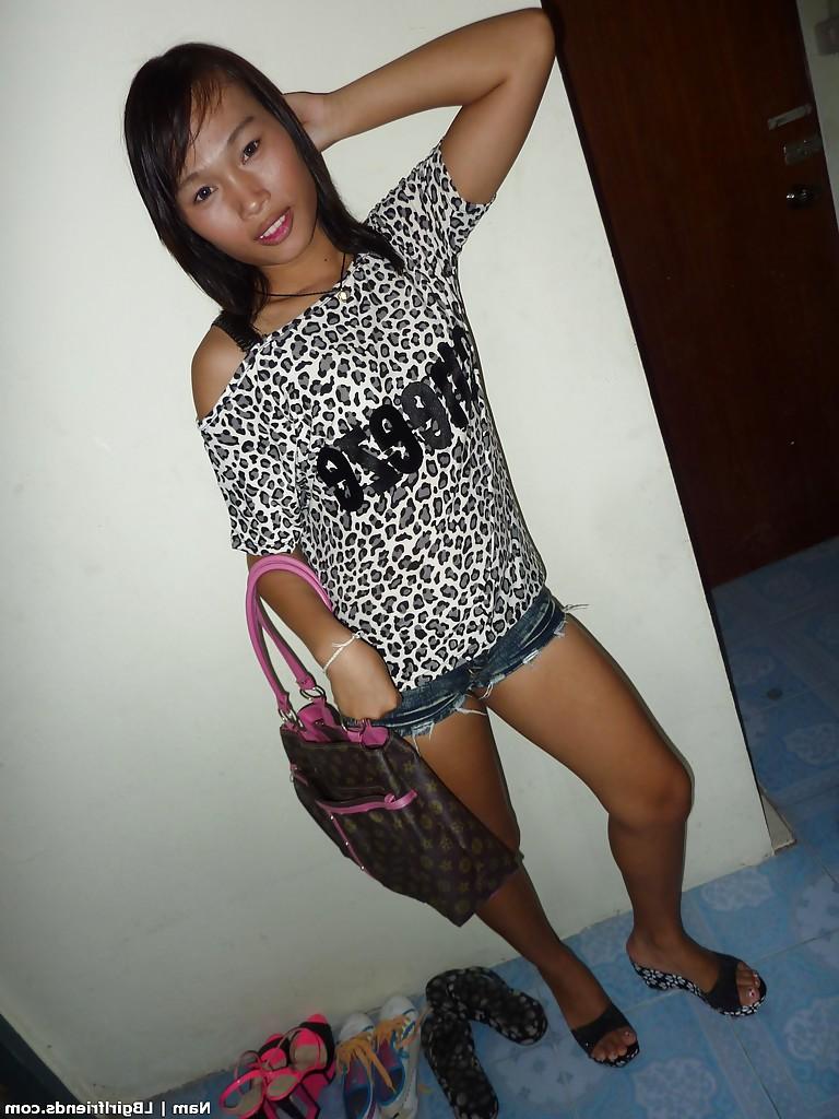 16P Slim Asian shemale strips nude and bares tiny tranny tits while jacking off