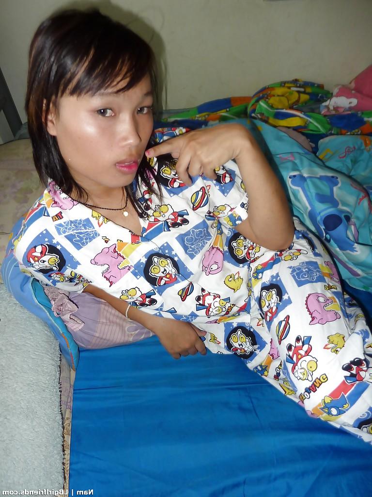 16P Slim Asian shemale strips nude and bares tiny tranny tits while jacking off