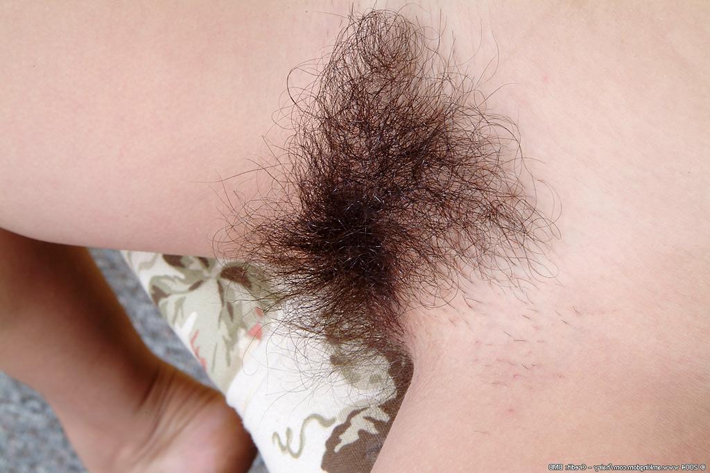 16P Latina Nancy's juicy pussy lips are surrounded by her thick hairy bush