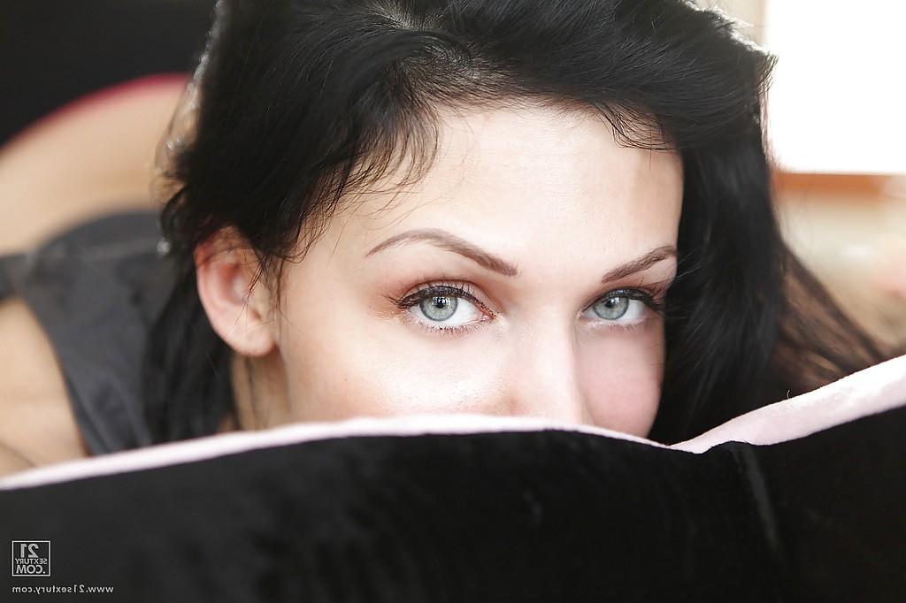 16P Pornstar with long legs Aletta Ocean is lying on her bed