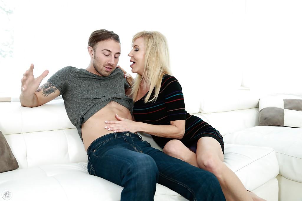 16P Mature blonde cougar Erica Lauren grabs hold of younger cock for tugjob