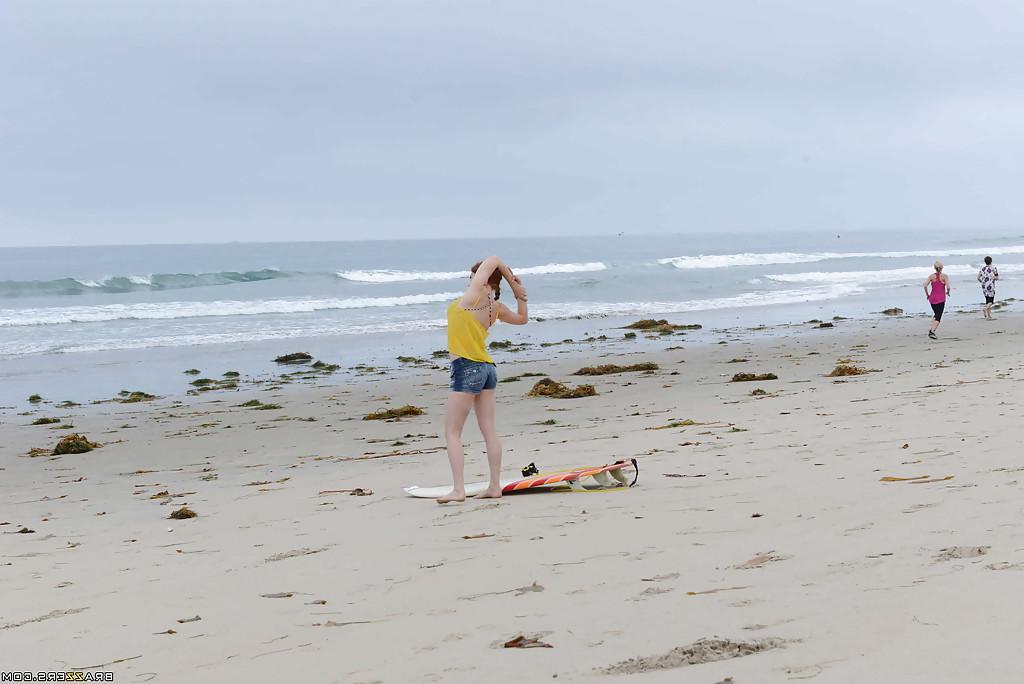 16P Ginger girl with large ass Penny is showing her skills on the beach