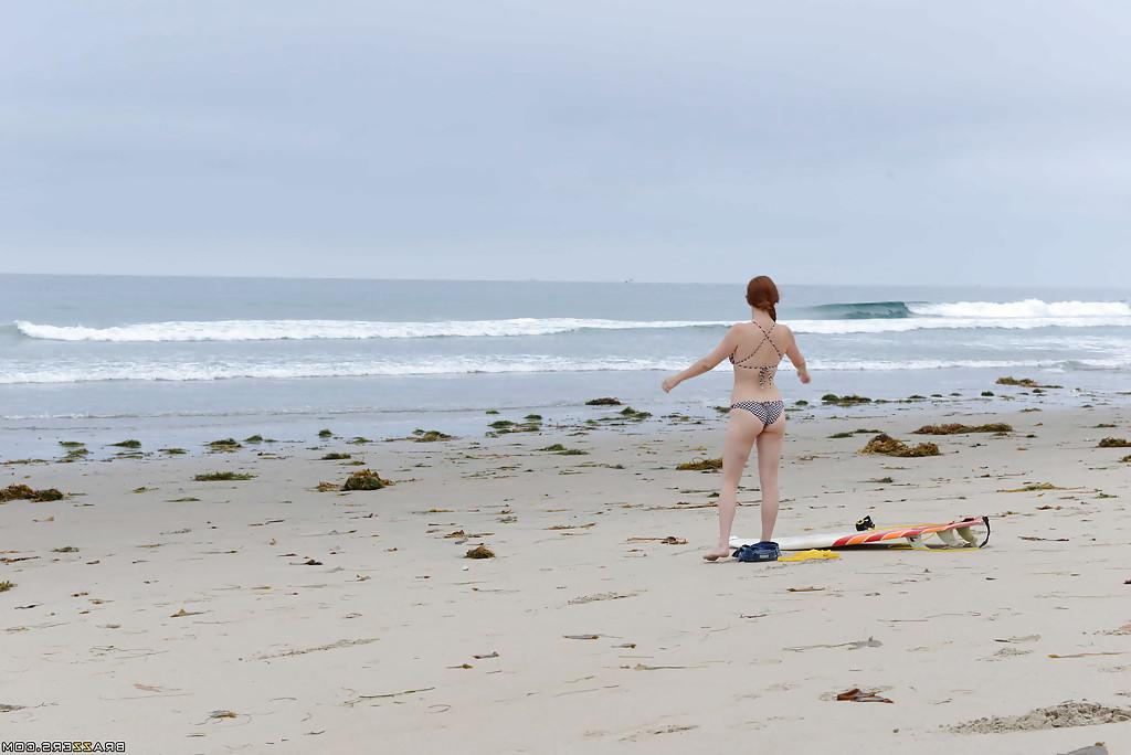 16P Ginger girl with large ass Penny is showing her skills on the beach