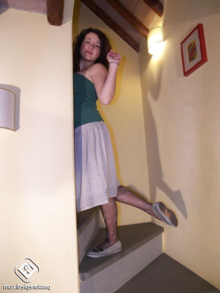 16P Ylenia is just sitting there on the stairs and showing her sexy legs