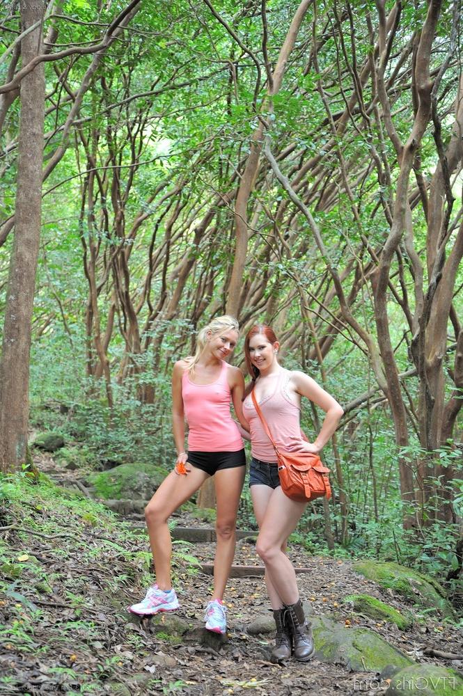 15P Two sexy lesbian chicks make out and spread their twats in the woods