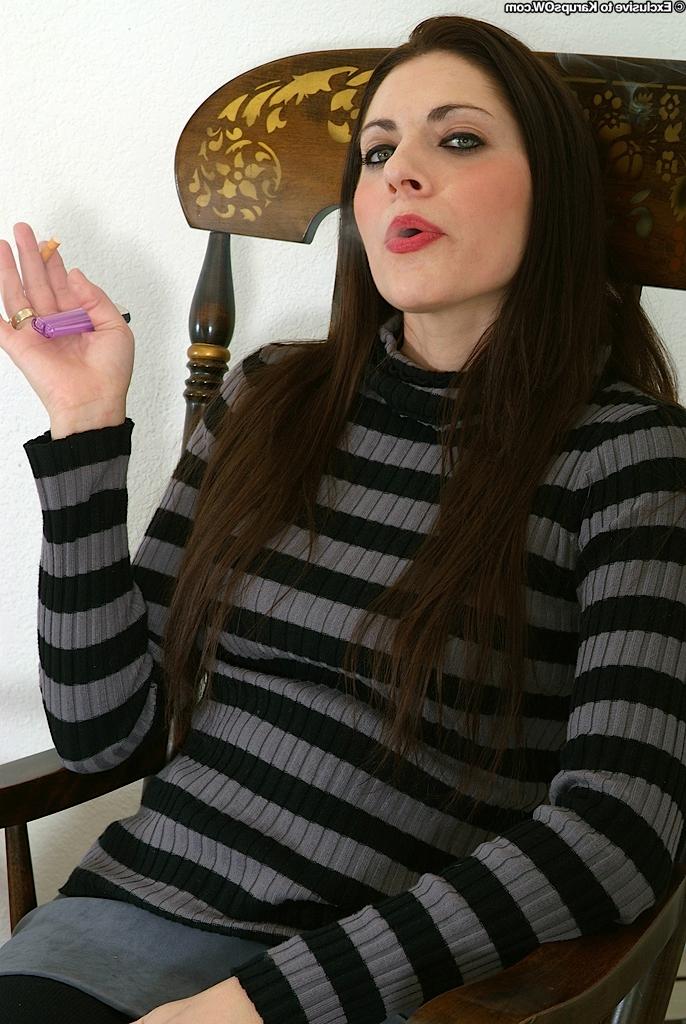16P Older smoking lady Dahlia posing in the nude after peeling off black pantyhose