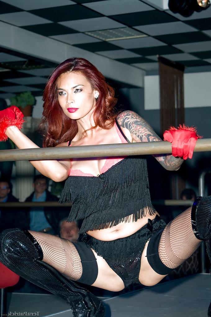 16P Asian pornstar Tera Patrick strutting in black stockings and boots
