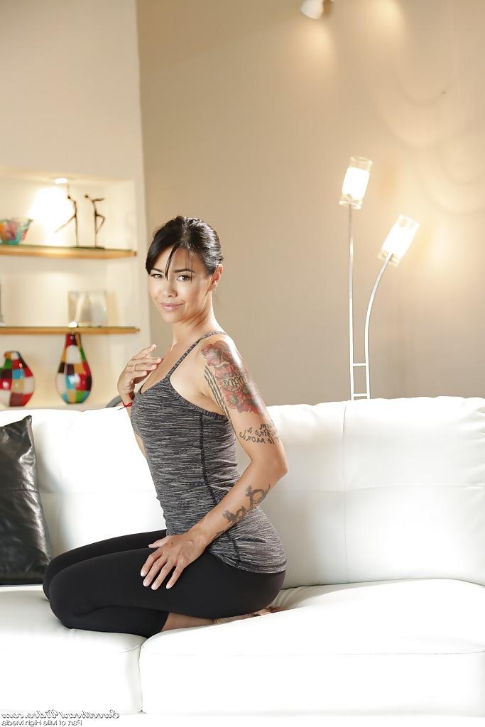 16P Tattooed babe Sara Luvv shows her slender naked shape on the bed