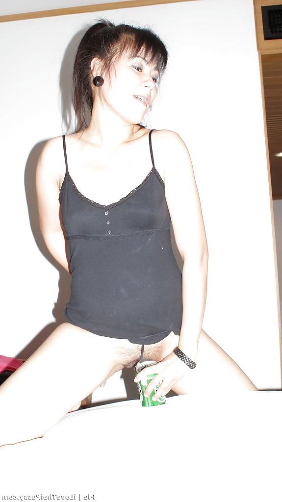 16P Naughty asian babe showing off her small titties and hairy pussy