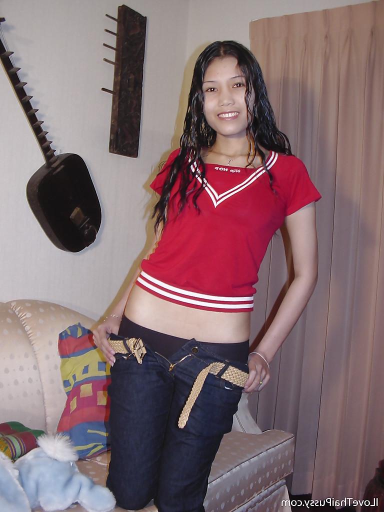 16P Cute asian babe slipping off her clothes and exposing her wey hairy pussy
