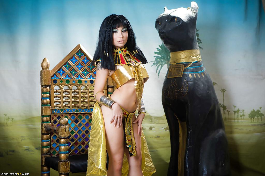 16P Brunette coed Rina Ellis peeling off Cleopatra themed cosplay outfit