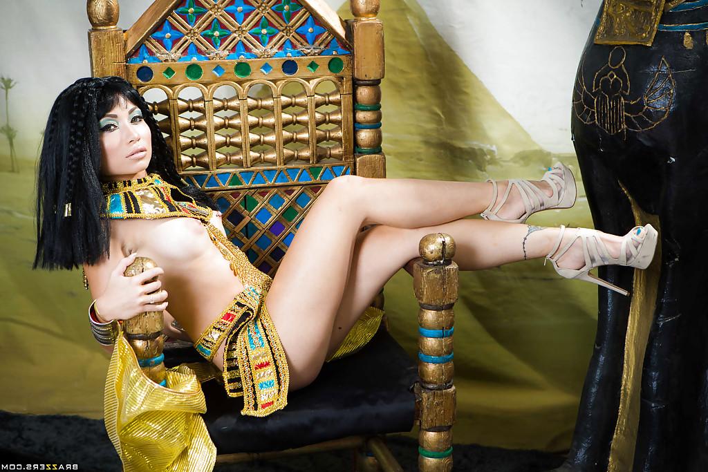 16P Brunette coed Rina Ellis peeling off Cleopatra themed cosplay outfit